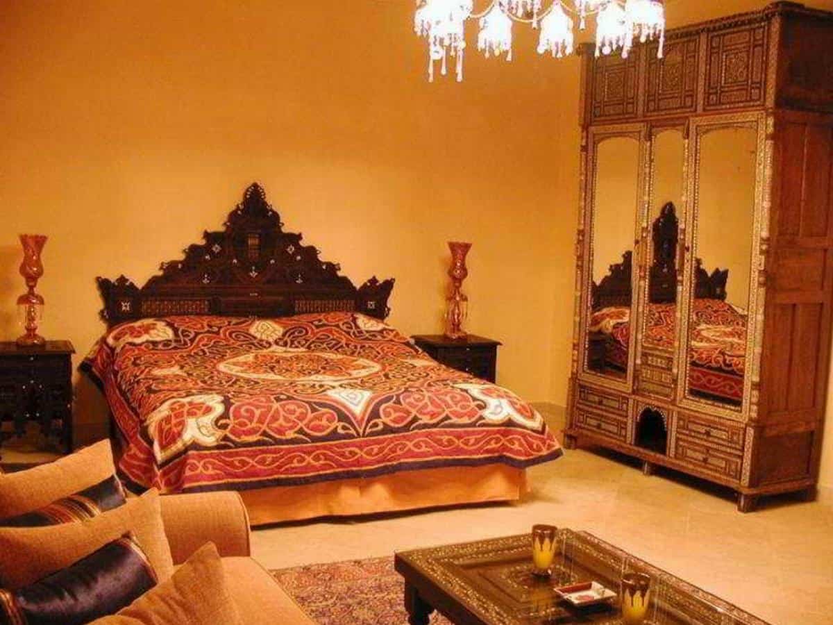 Talisman Hotel guest room with traditional furnishings